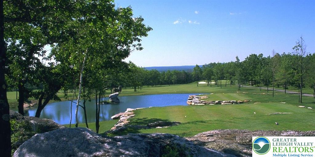370 Inverness Lane Hazleton, PA 18202 - Photo 8 of 8 a view of a golf course with a lake