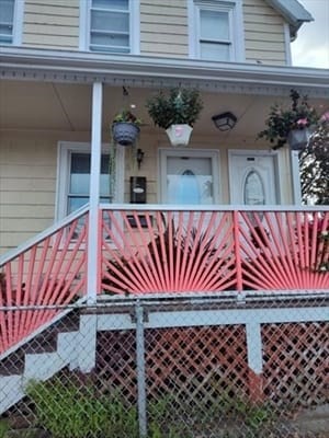 a view of a patio with a table and chairs