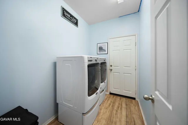 a hallway with washer and dryer