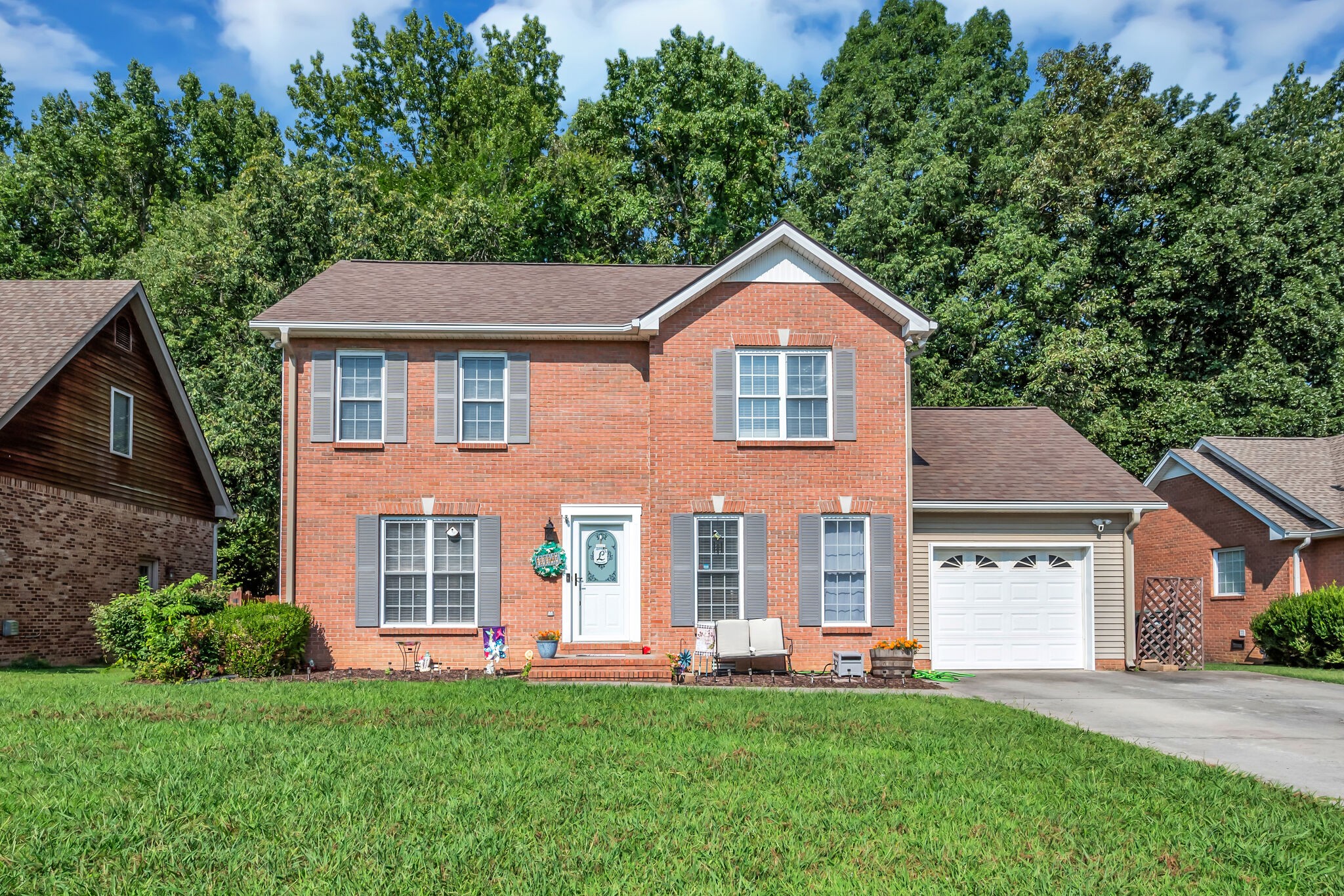 a front view of a house with a yard