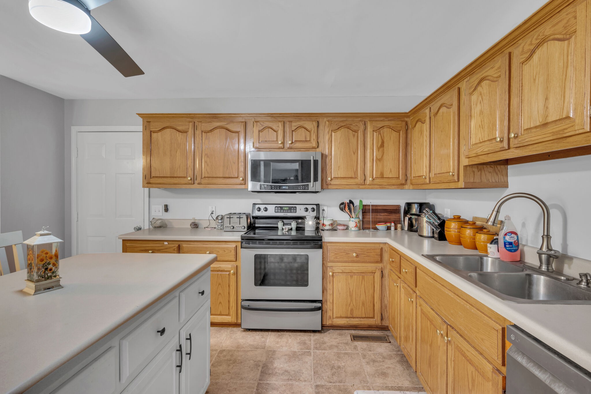 156 Foxrun Springfield, TN 37172 - Photo 15 of 31 a kitchen with stainless steel appliances granite countertop a sink and cabinets