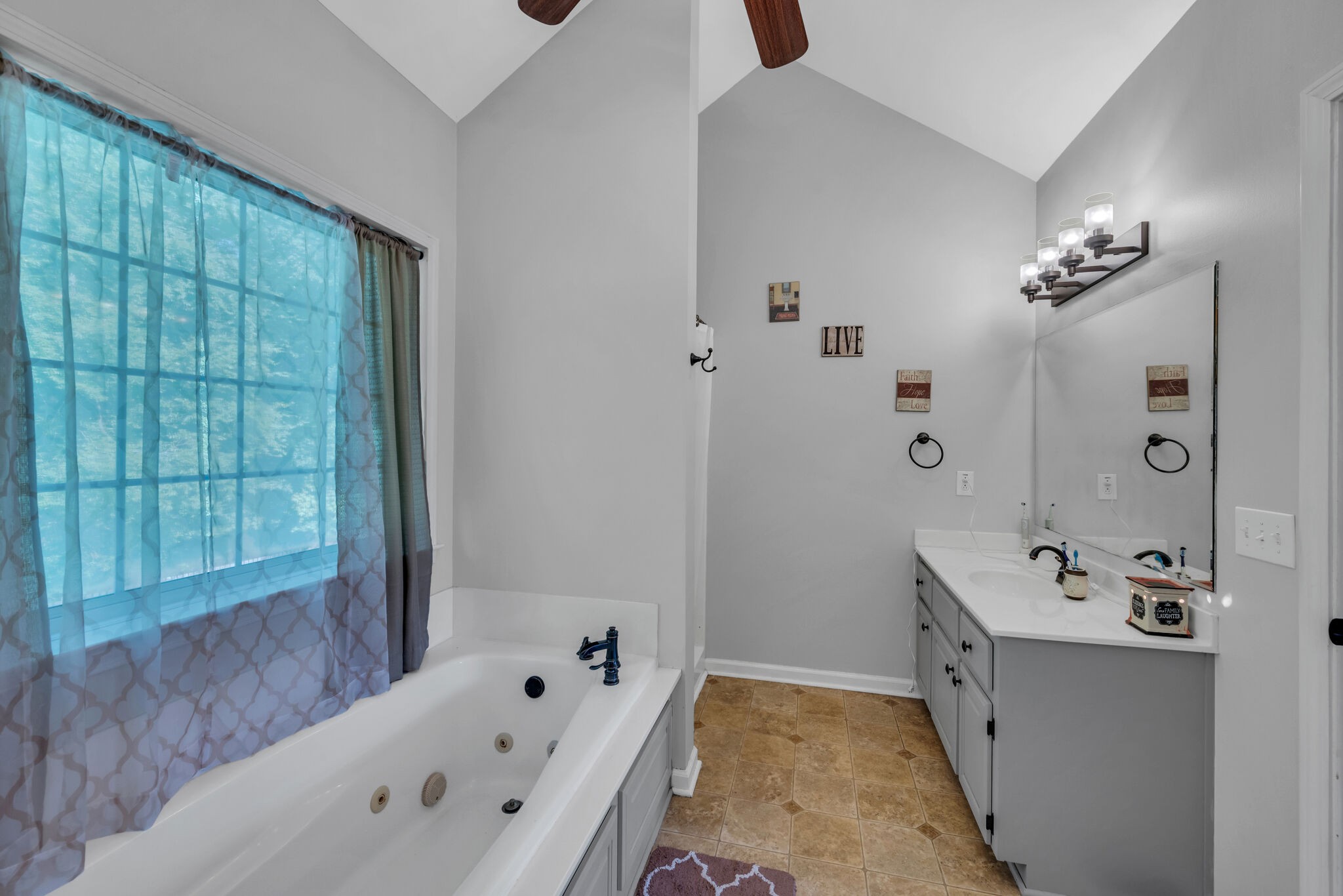156 Foxrun Springfield, TN 37172 - Photo 23 of 31 a bathroom with a tub sink and mirror