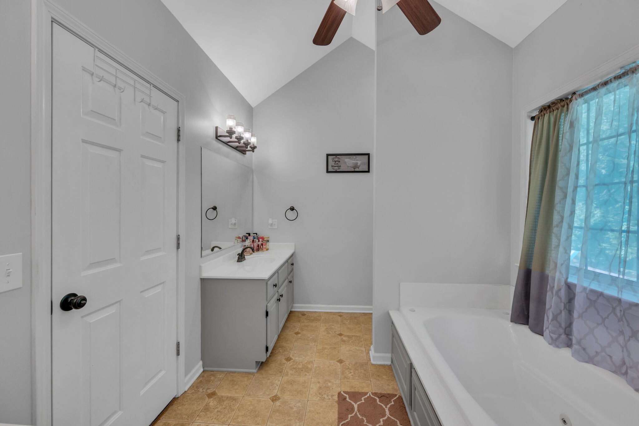 156 Foxrun Springfield, TN 37172 - Photo 24 of 31 a bathroom with a sink a toilet a window and shower