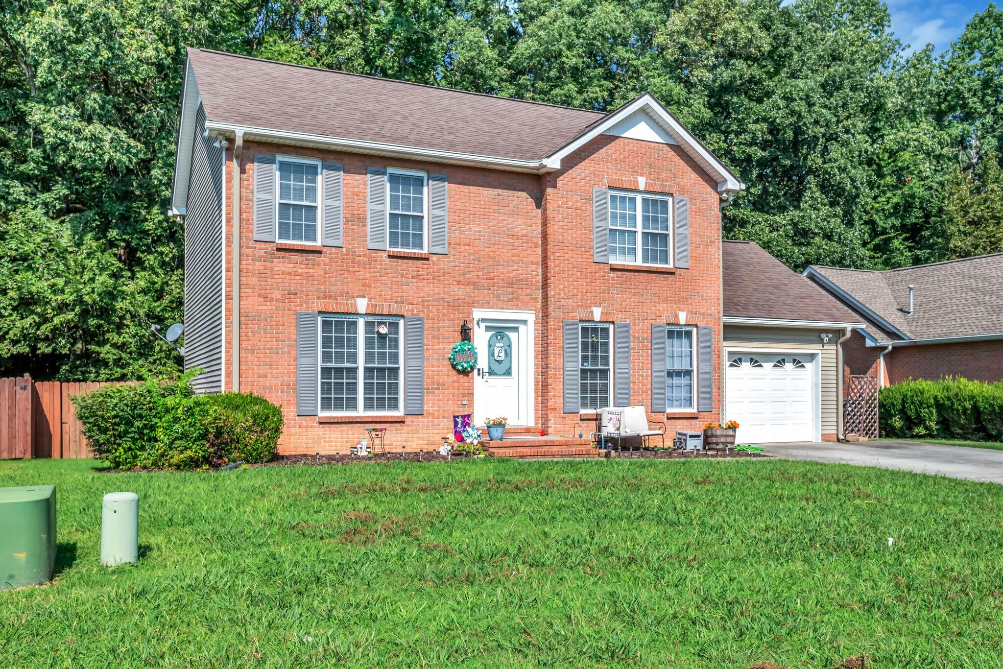 156 Foxrun Springfield, TN 37172 - Photo 3 of 31 a front view of a house with a yard and trees
