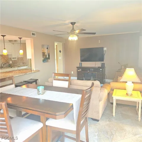 a dining room with a table and chairs