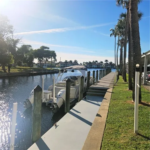 a view of a balcony with wooden floor and lake view
