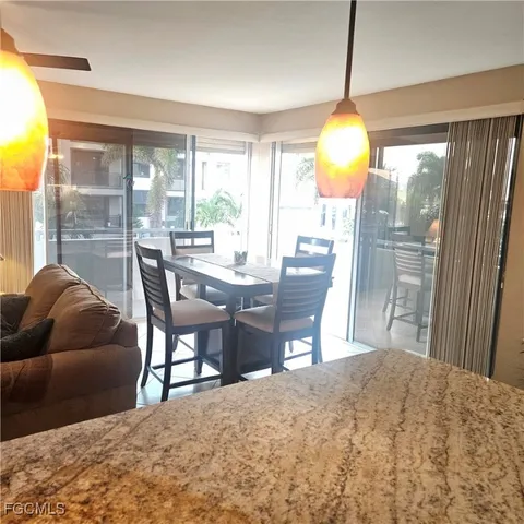 a workspace with furniture and a large window