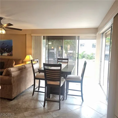 a view of a dining room with furniture window and outside view