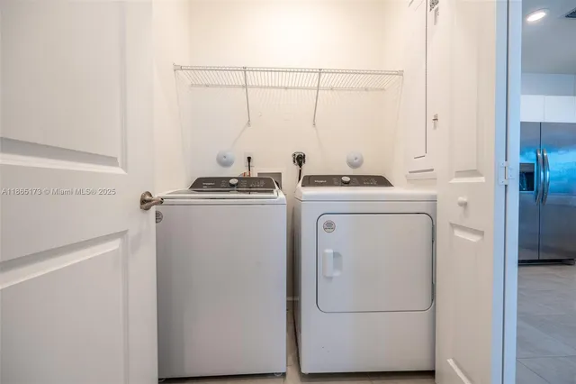a utility room with dryer and washer