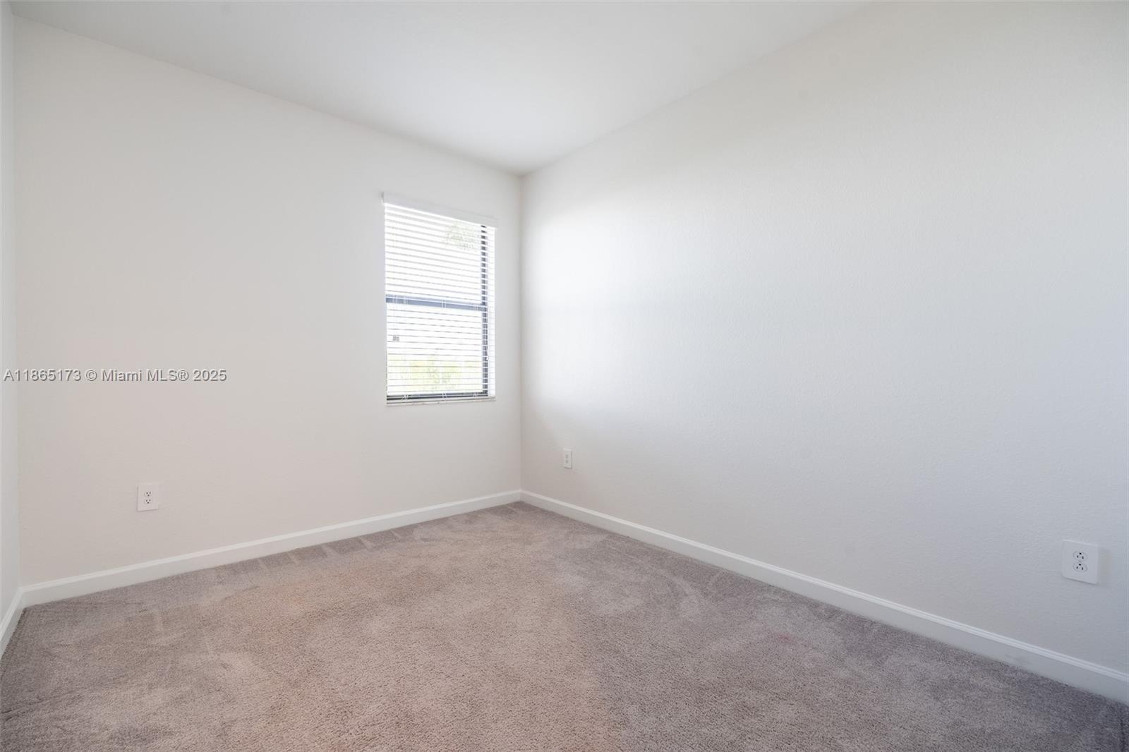 24720 Southwest 119th Place, Unit 24720 Homestead, FL 33032 - Photo 18 of 30 an empty room with windows