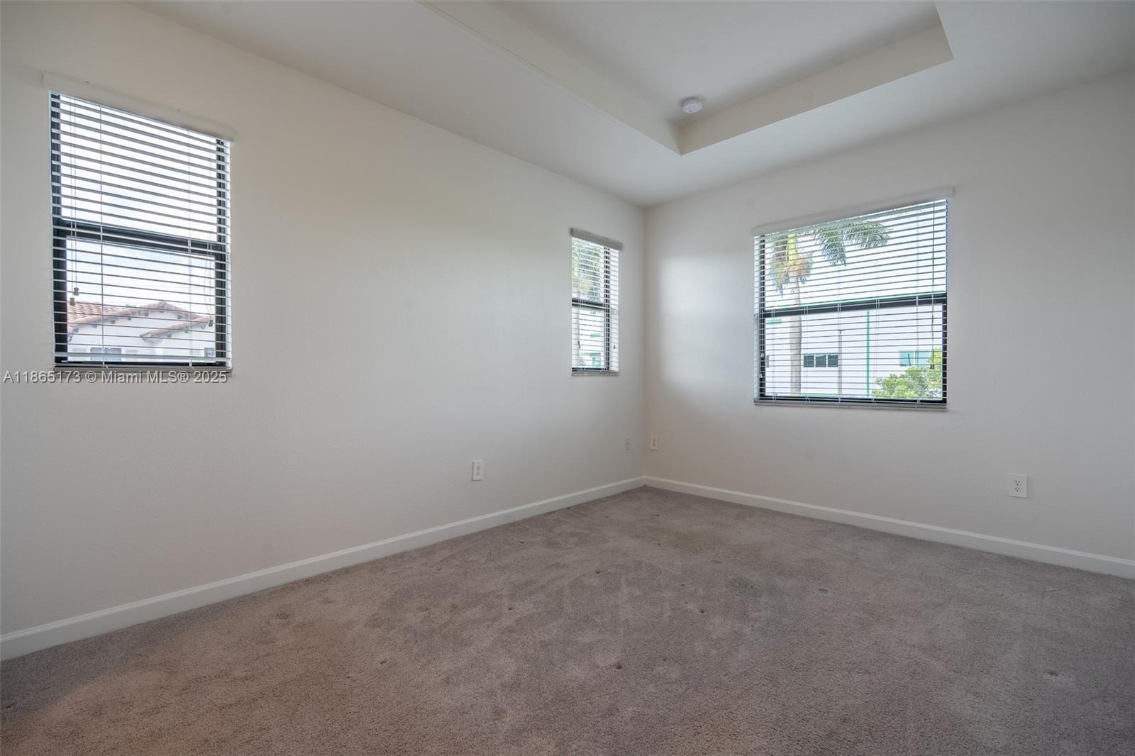 24720 Southwest 119th Place, Unit 24720 Homestead, FL 33032 - Photo 20 of 30 an empty room with windows