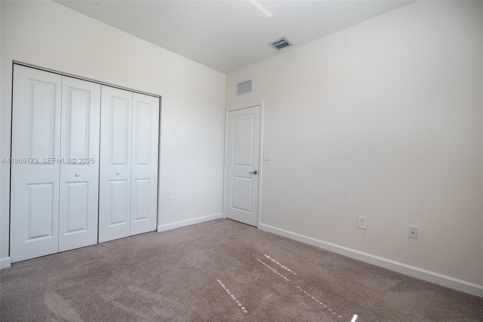 24720 Southwest 119th Place, Unit 24720 Homestead, FL 33032 - Photo 25 of 30 a view of an empty room