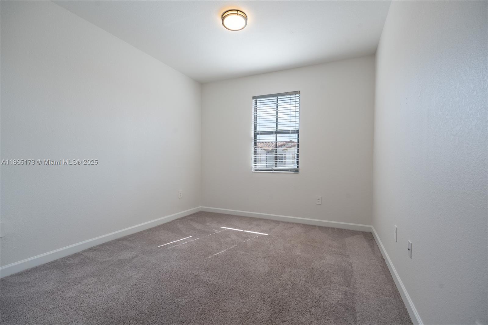 24720 Southwest 119th Place, Unit 24720 Homestead, FL 33032 - Photo 26 of 30 an empty room with windows