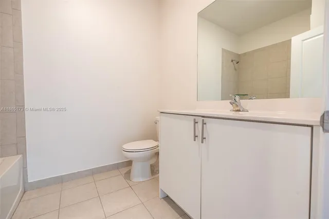 a bathroom with a sink a toilet and bathtub