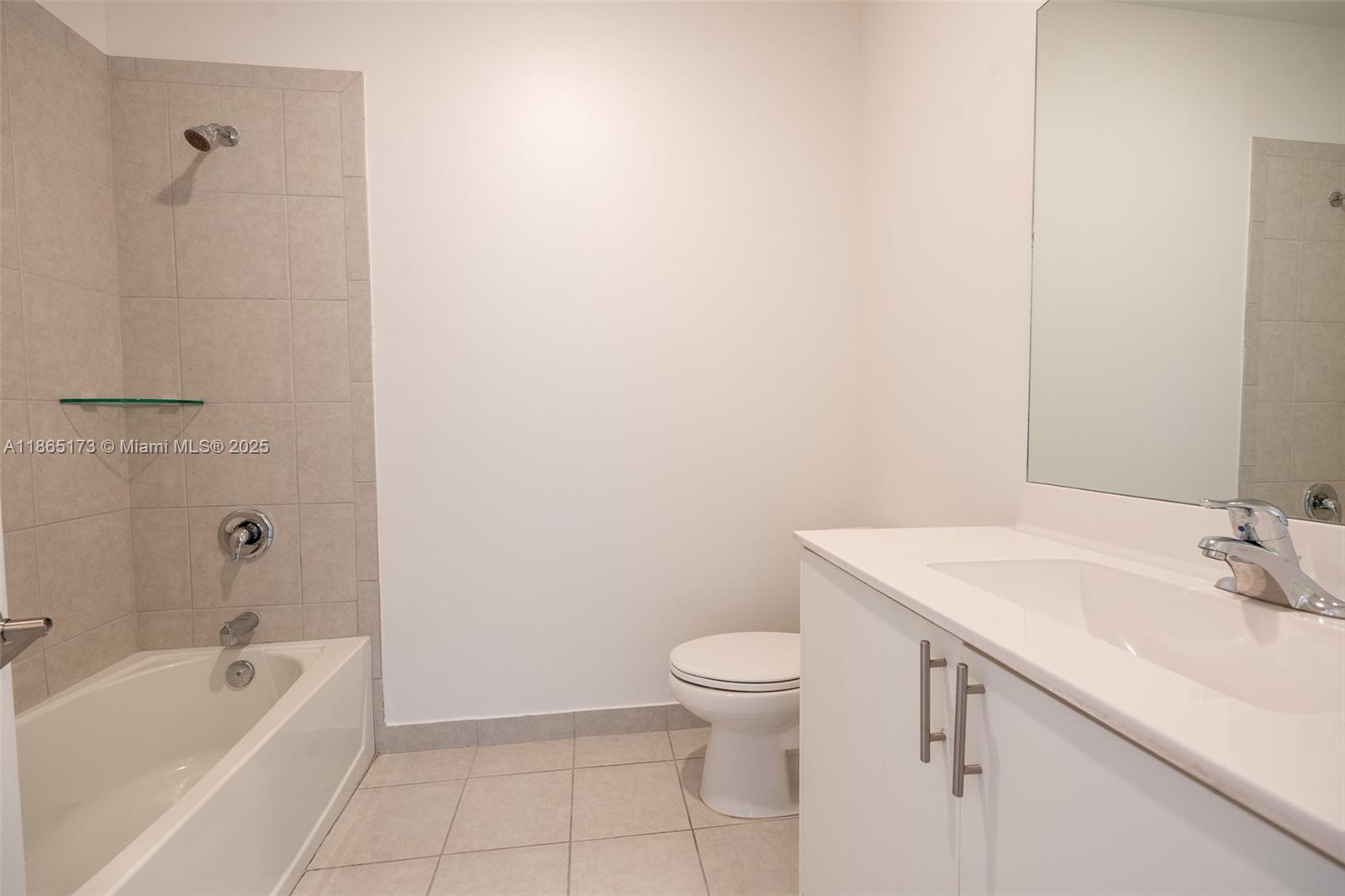 24720 Southwest 119th Place, Unit 24720 Homestead, FL 33032 - Photo 30 of 30 a bathroom with a sink a toilet and bathtub