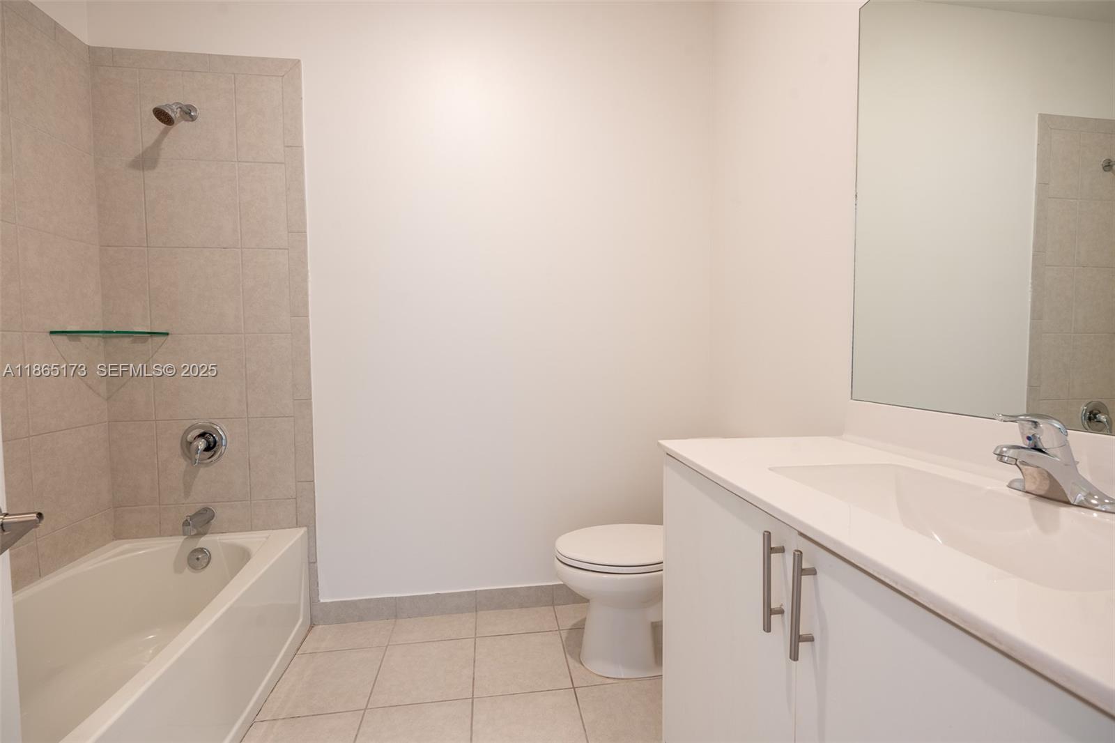 24720 Southwest 119th Place, Unit 24720 Homestead, FL 33032 - Photo 30 of 30 a bathroom with a sink a toilet and bathtub