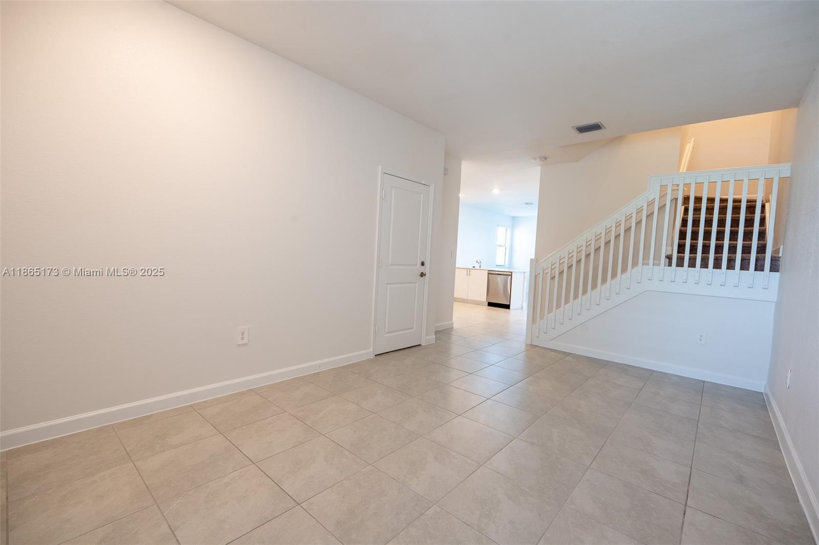 24720 Southwest 119th Place, Unit 24720 Homestead, FL 33032 - Photo 8 of 30 a view of an entryway with stairs