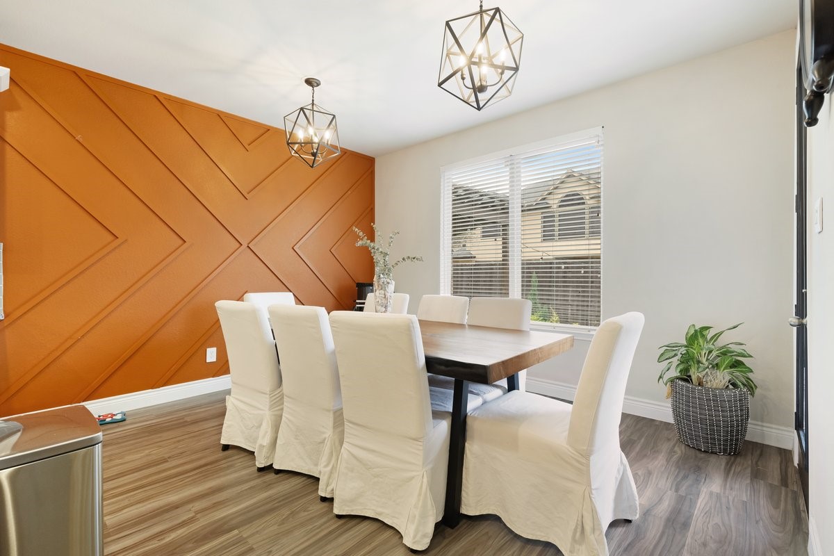 15815 Gibson Grass Court Spring, TX 77379 - Photo 11 of 26 Custom feature wall with a cheerful vibe, complemented by updated lighting and large windows for natural light. Back door opens to your outdoor paradise