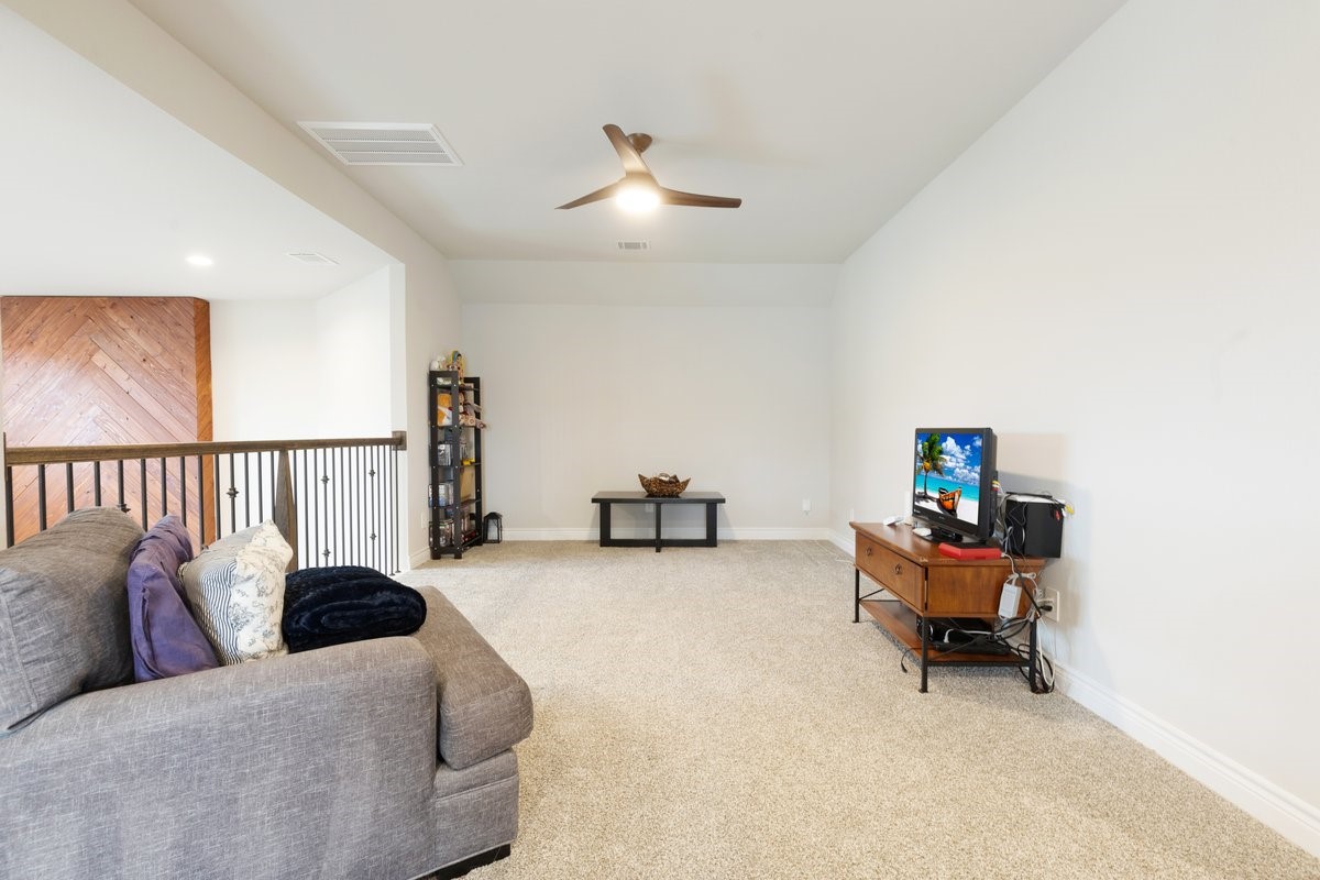15815 Gibson Grass Court Spring, TX 77379 - Photo 16 of 26 Open and functional game room overlooking the floor below, with two nearby bedrooms and a full bath.