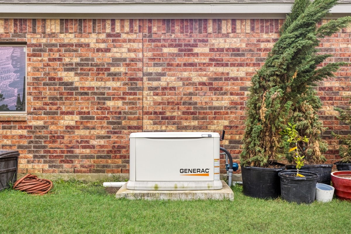 15815 Gibson Grass Court Spring, TX 77379 - Photo 23 of 26 The home is equipped with a whole-house generator, ensuring uninterrupted power and peace of mind during outages.