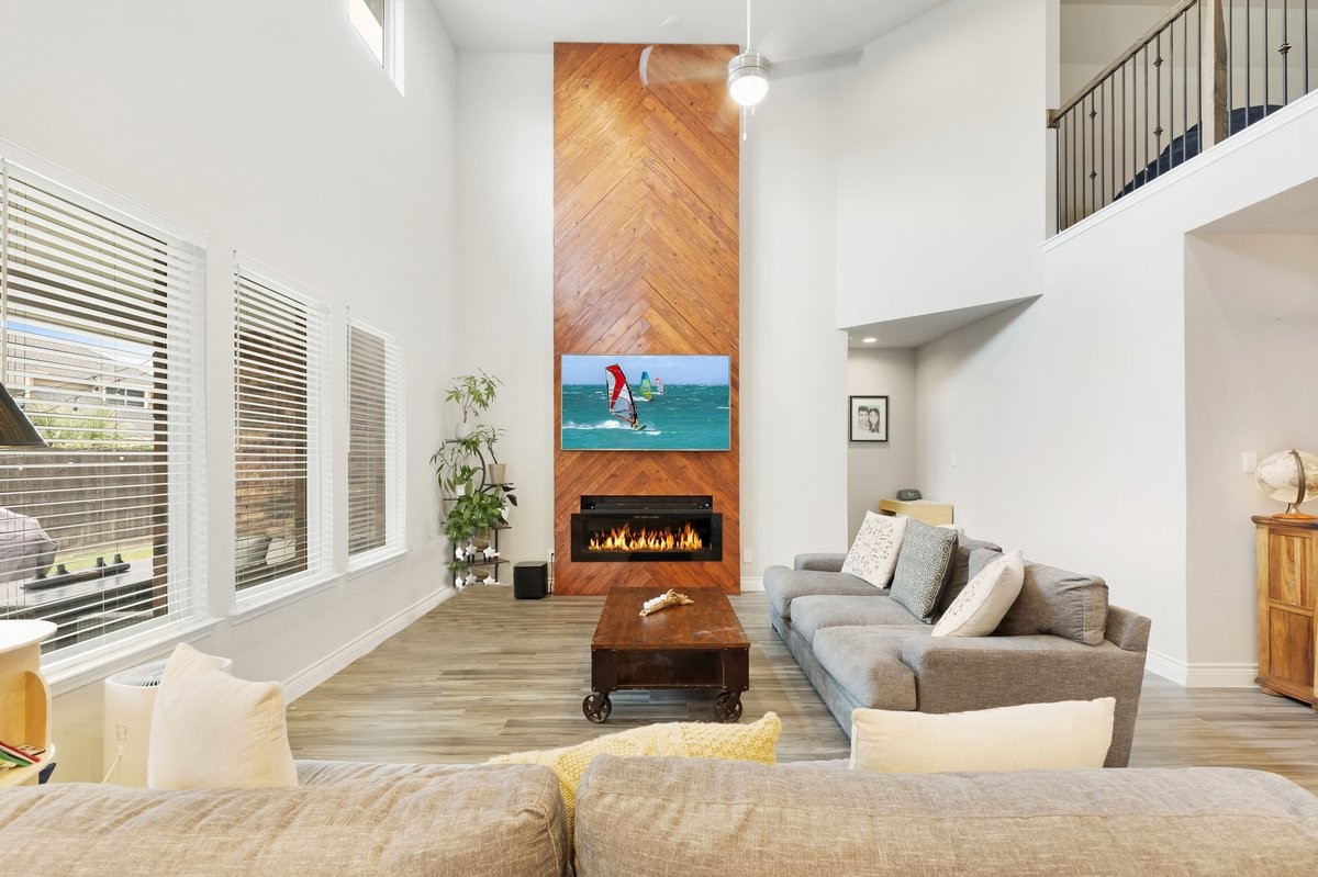 15815 Gibson Grass Court Spring, TX 77379 - Photo 5 of 26 Bright family room with ample space for furniture and décor, ideal for entertaining or relaxing.