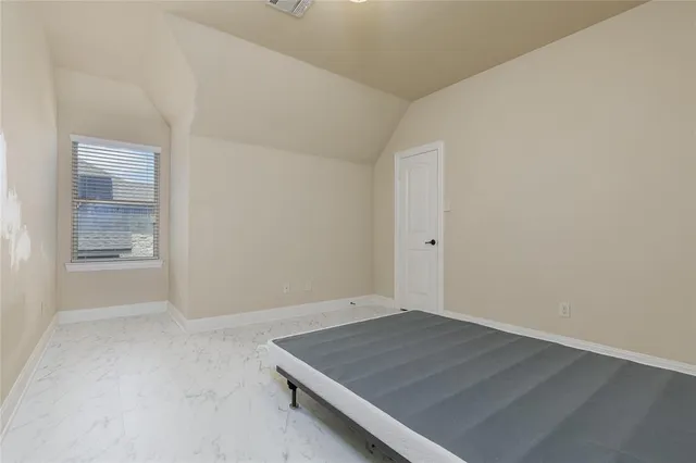 an empty room with a bench