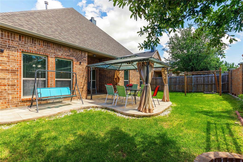 404 Tanner Square McKinney, TX 75072 - Photo 32 of 34 View of yard featuring a gazebo and a patio
