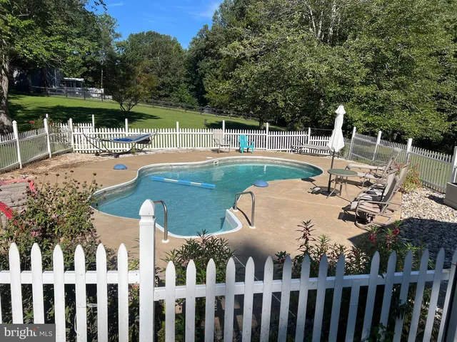 a view of a patio with swimming pool