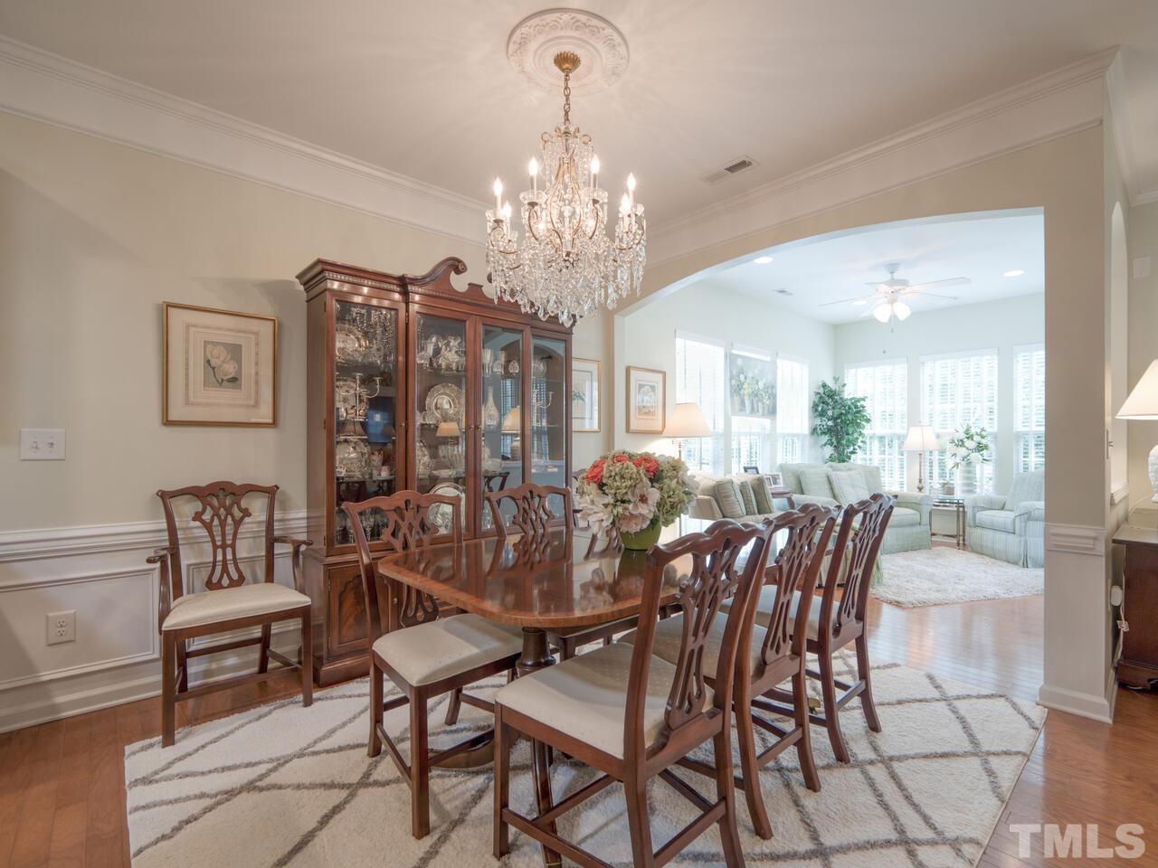 724 Eldridge Loop Cary, NC 27519 - Photo 12 of 38 a view of a dining room with furniture and chandelier