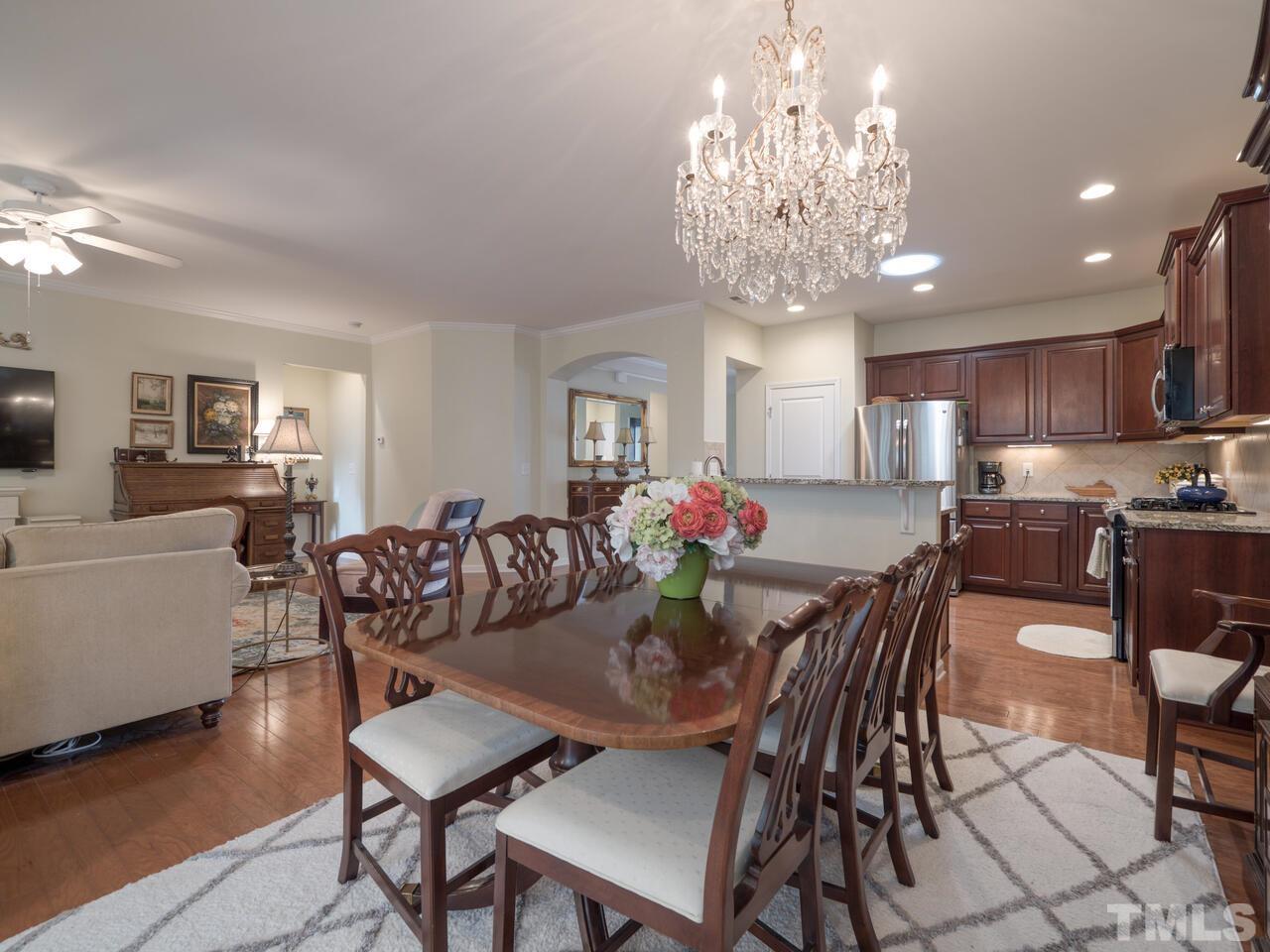 724 Eldridge Loop Cary, NC 27519 - Photo 2 of 38 a view of a dining room with furniture and wooden floor