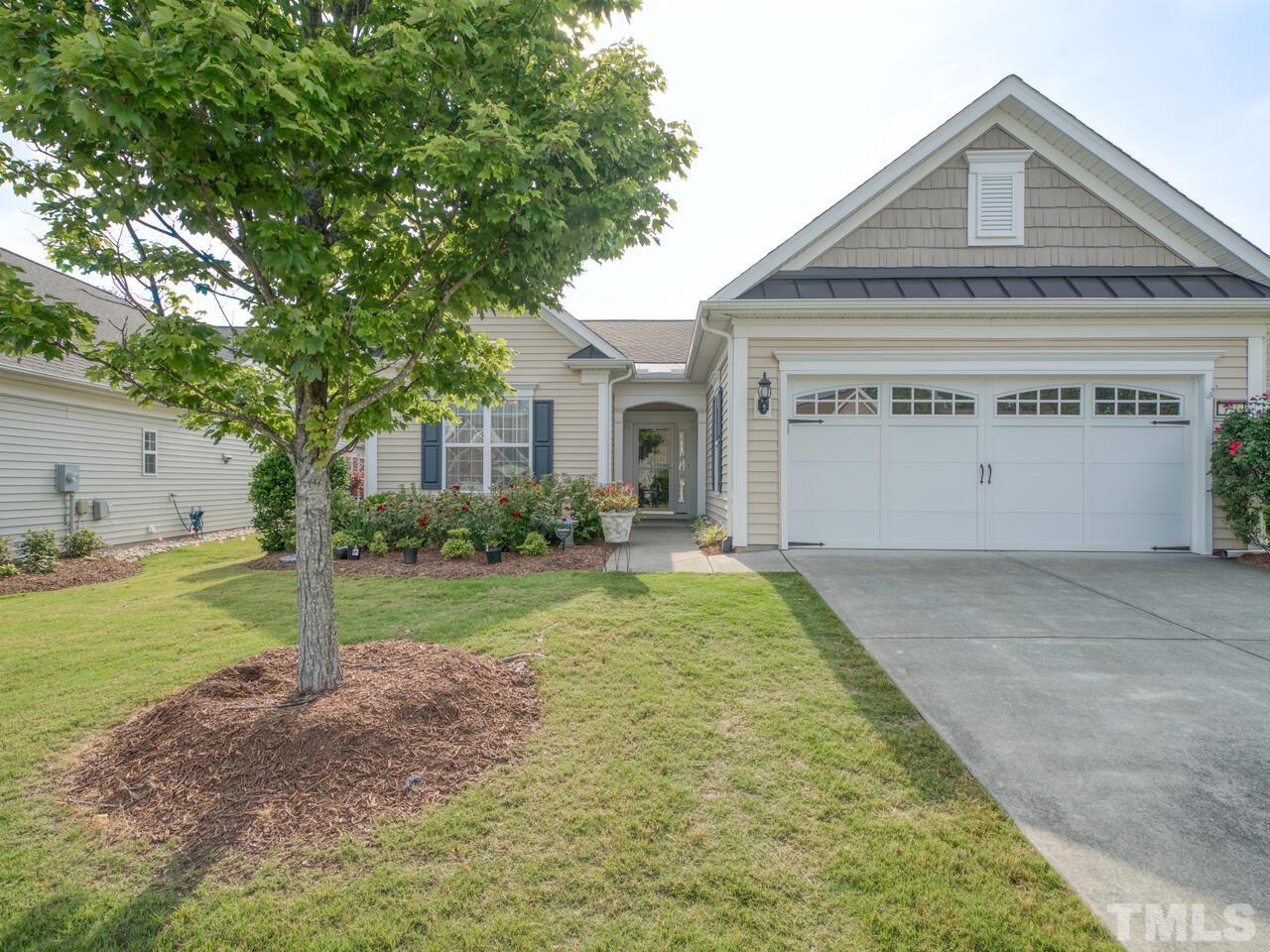 724 Eldridge Loop Cary, NC 27519 - Photo 37 of 38 a front view of a house with a yard