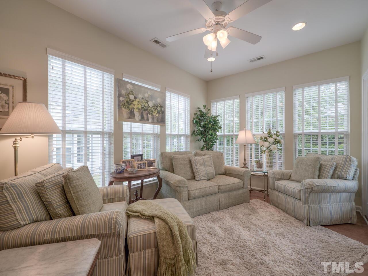 724 Eldridge Loop Cary, NC 27519 - Photo 9 of 38 a living room with furniture and a large window