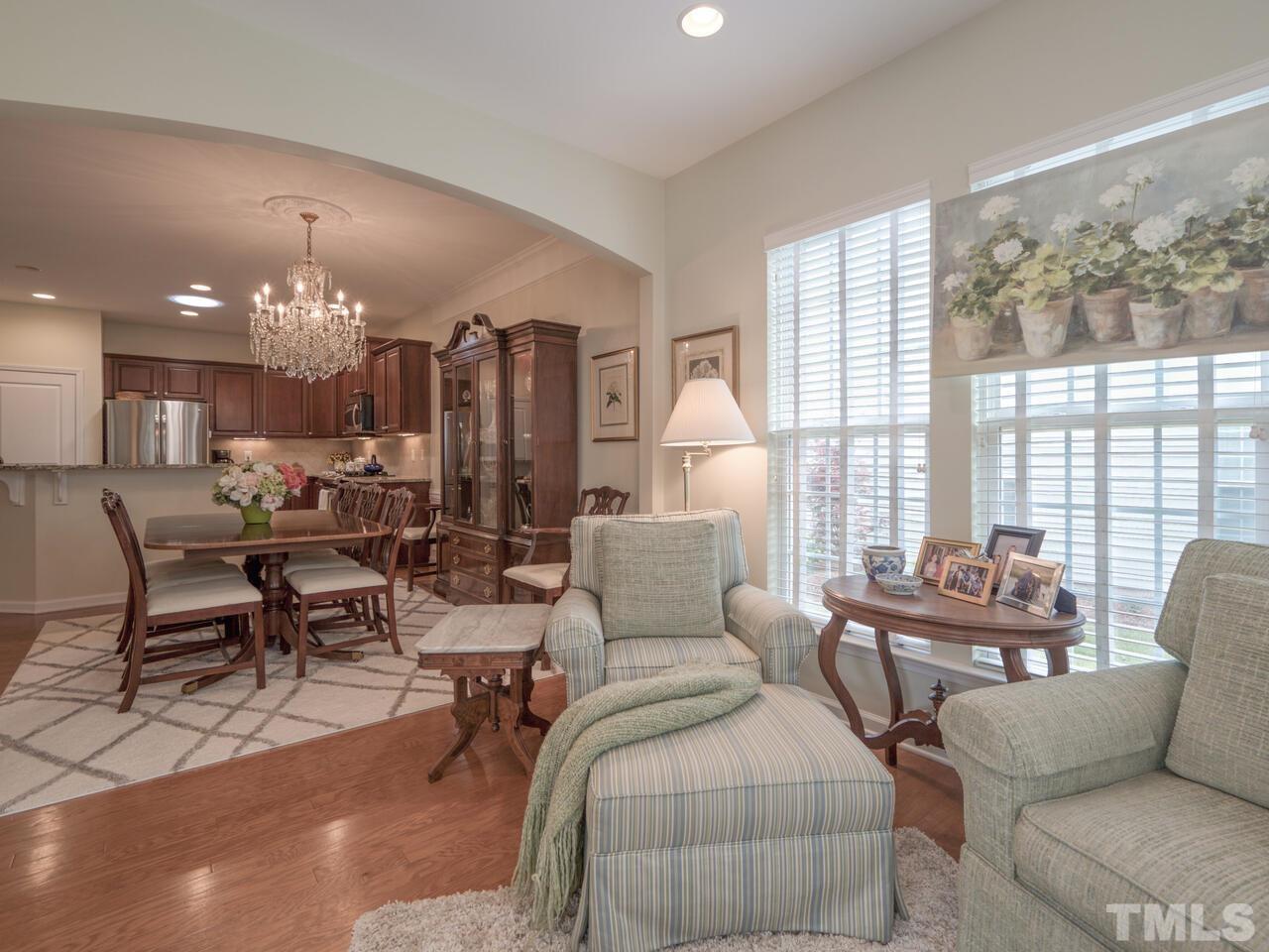 724 Eldridge Loop Cary, NC 27519 - Photo 10 of 38 a living room with furniture and a large window