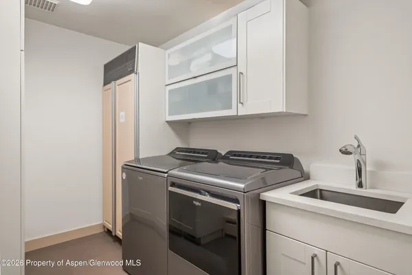 a kitchen with a stove and a sink