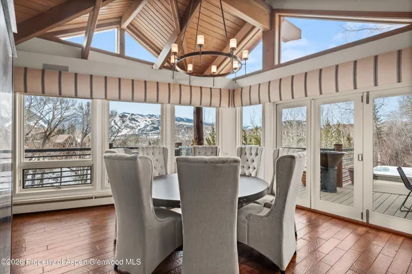 a view of a dining room with furniture window and wooden floor