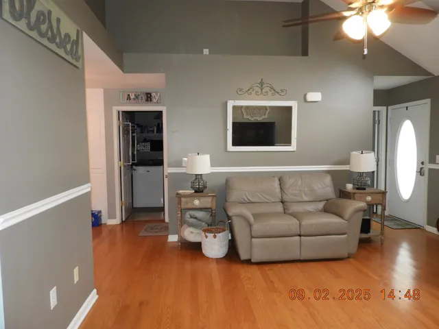 a spacious bedroom with a bed and a dresser