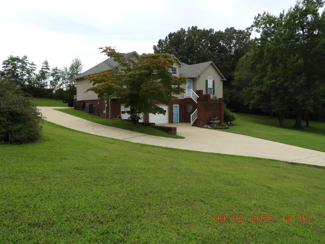 a view of a house with a park
