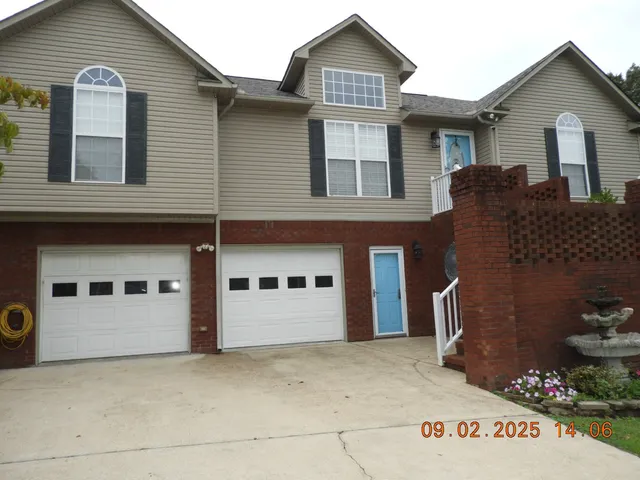 a view of a house with large windows