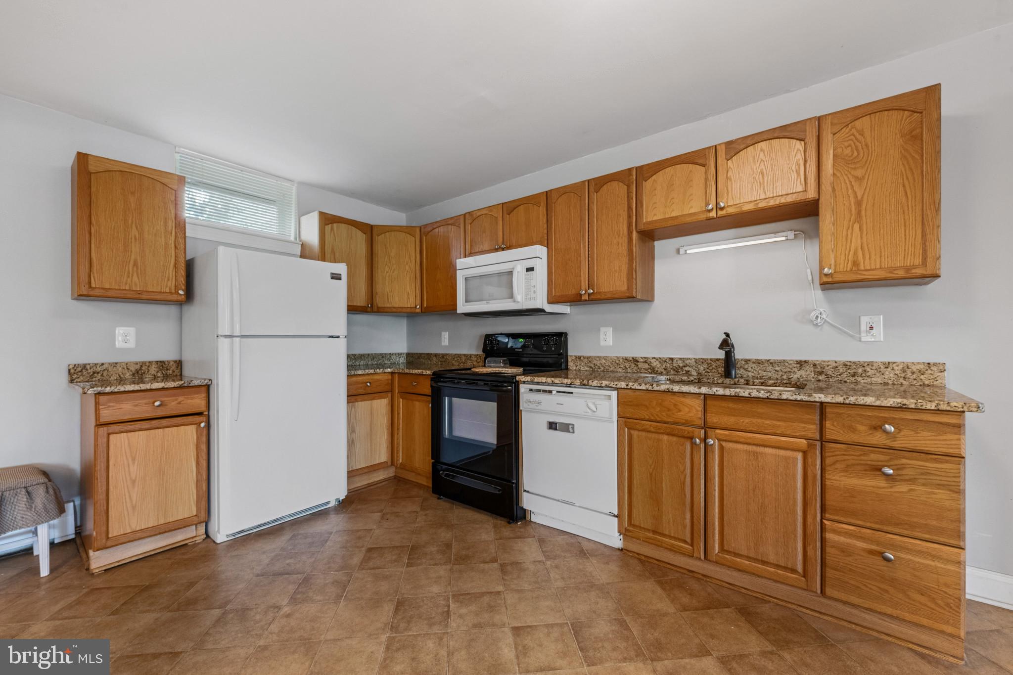 14111 Longnecker Road Glyndon, MD 21136 - Photo 17 of 51 Modern kitchen with warm wood tones.