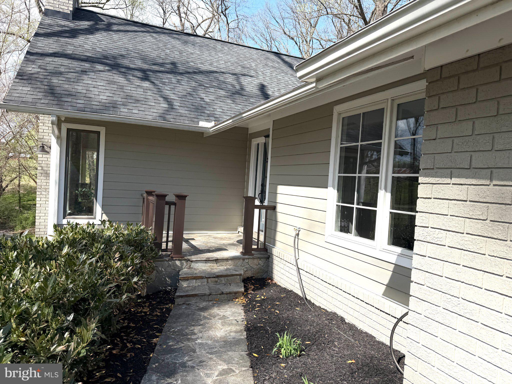 14111 Longnecker Road Glyndon, MD 21136 - Photo 2 of 5 Charming entryway with lush greenery.