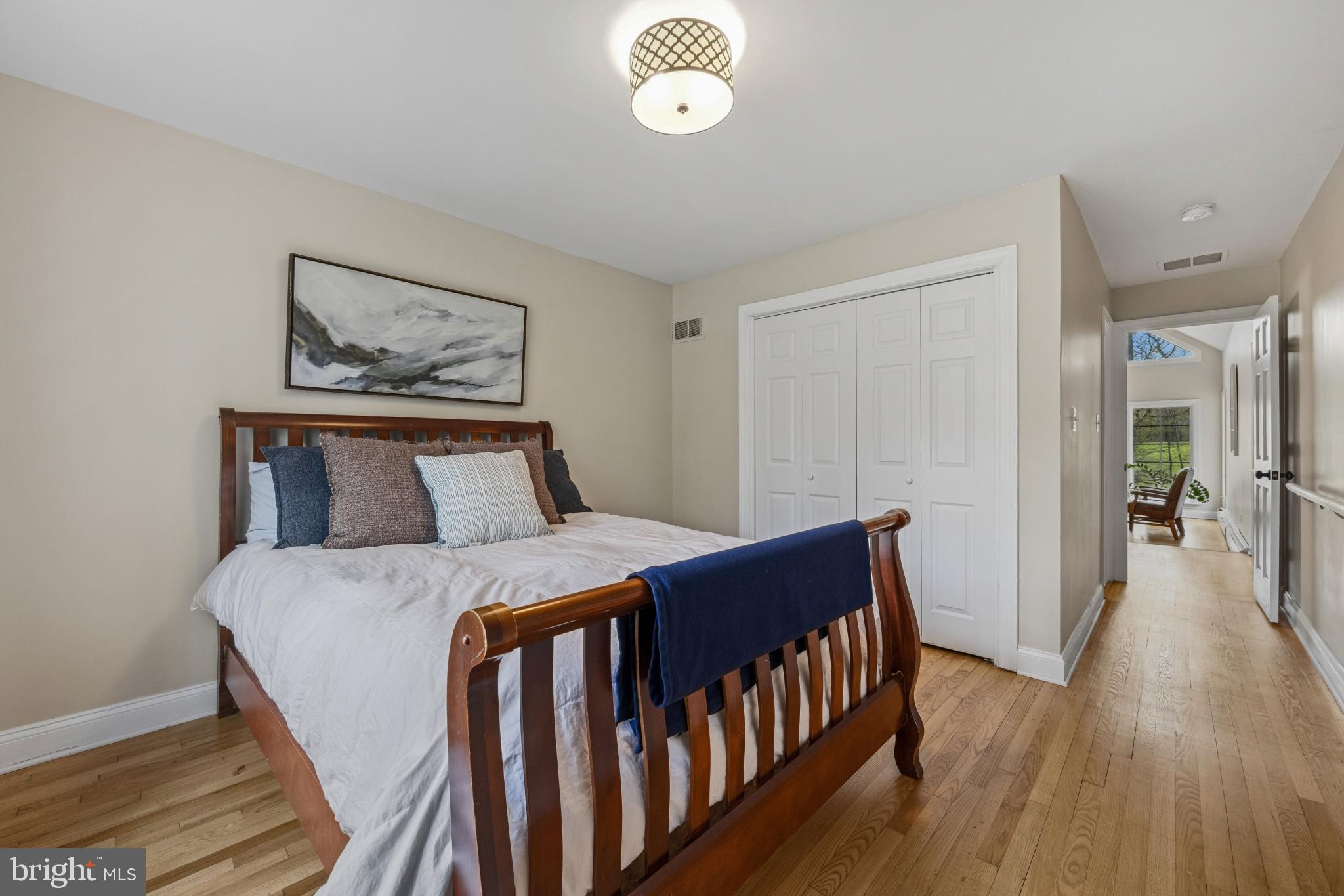 14111 Longnecker Road Glyndon, MD 21136 - Photo 23 of 51 Serene bedroom with warm wood accents.