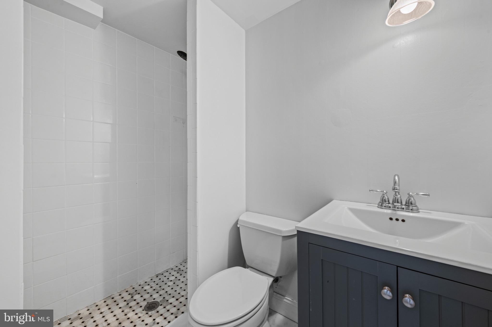 14111 Longnecker Road Glyndon, MD 21136 - Photo 27 of 51 Sleek modern bathroom with stylish fixtures.