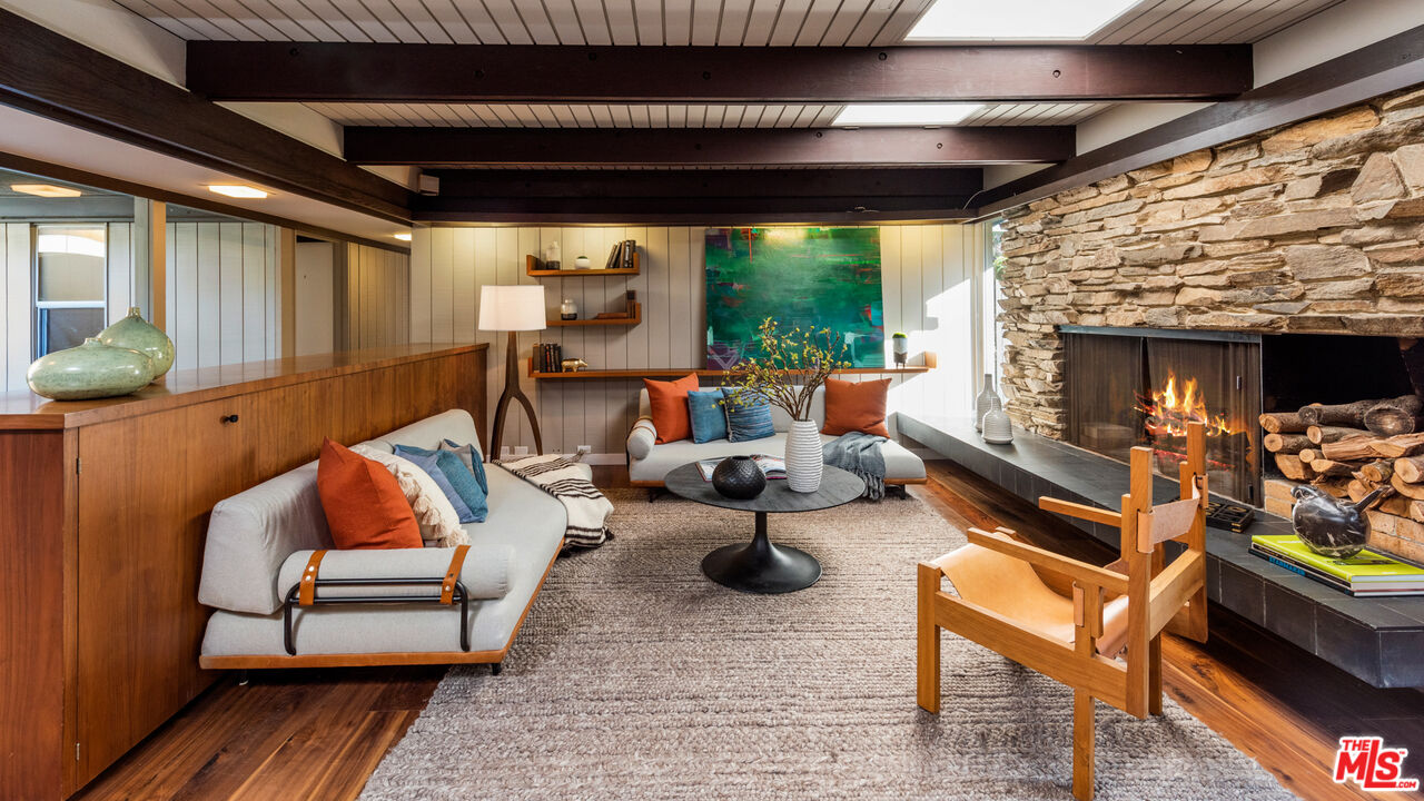 1030 Rivas Canyon Road Pacific Palisades, CA 90272 - Photo 12 of 42 a outdoor space with patio couch and a potted plant