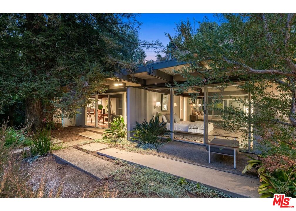 1030 Rivas Canyon Road Pacific Palisades, CA 90272 - Photo 16 of 42 a view of a house with backyard and sitting area