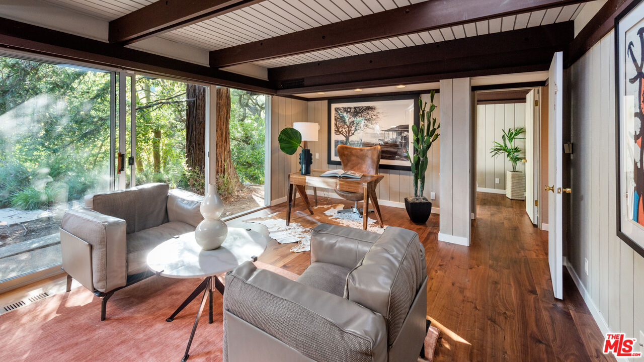 1030 Rivas Canyon Road Pacific Palisades, CA 90272 - Photo 17 of 42 a living room with furniture and a large window