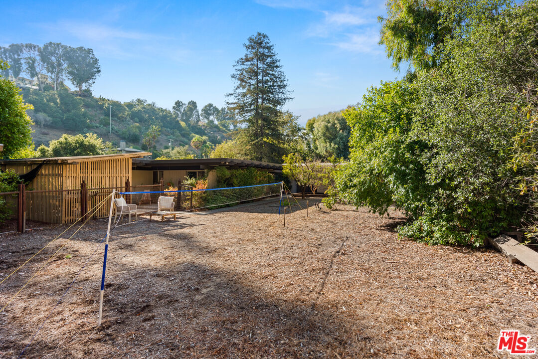 1030 Rivas Canyon Road Pacific Palisades, CA 90272 - Photo 29 of 42 a backyard of a house with lots of green space