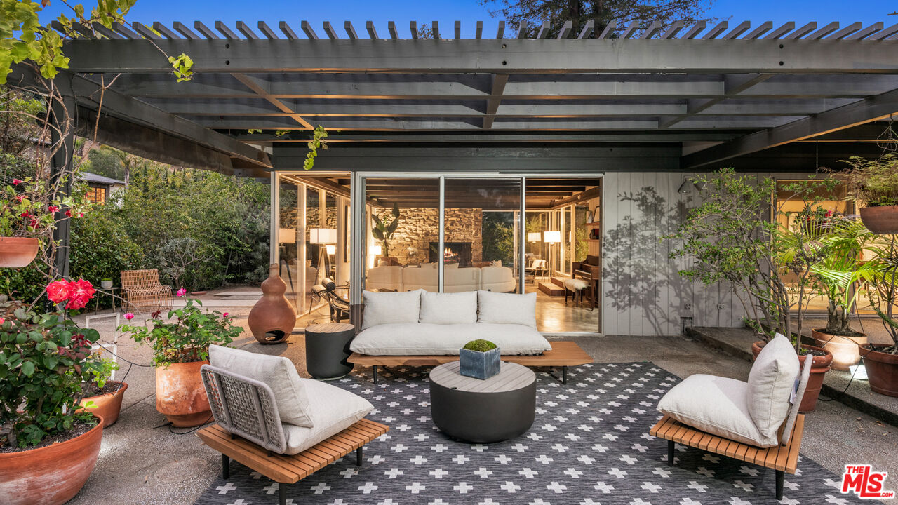 1030 Rivas Canyon Road Pacific Palisades, CA 90272 - Photo 3 of 42 a outdoor living space with furniture and garden