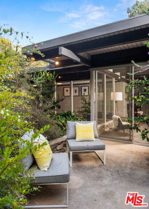 1030 Rivas Canyon Road Pacific Palisades, CA 90272 - Photo 32 of 42 a outdoor living space with furniture and a potted plant