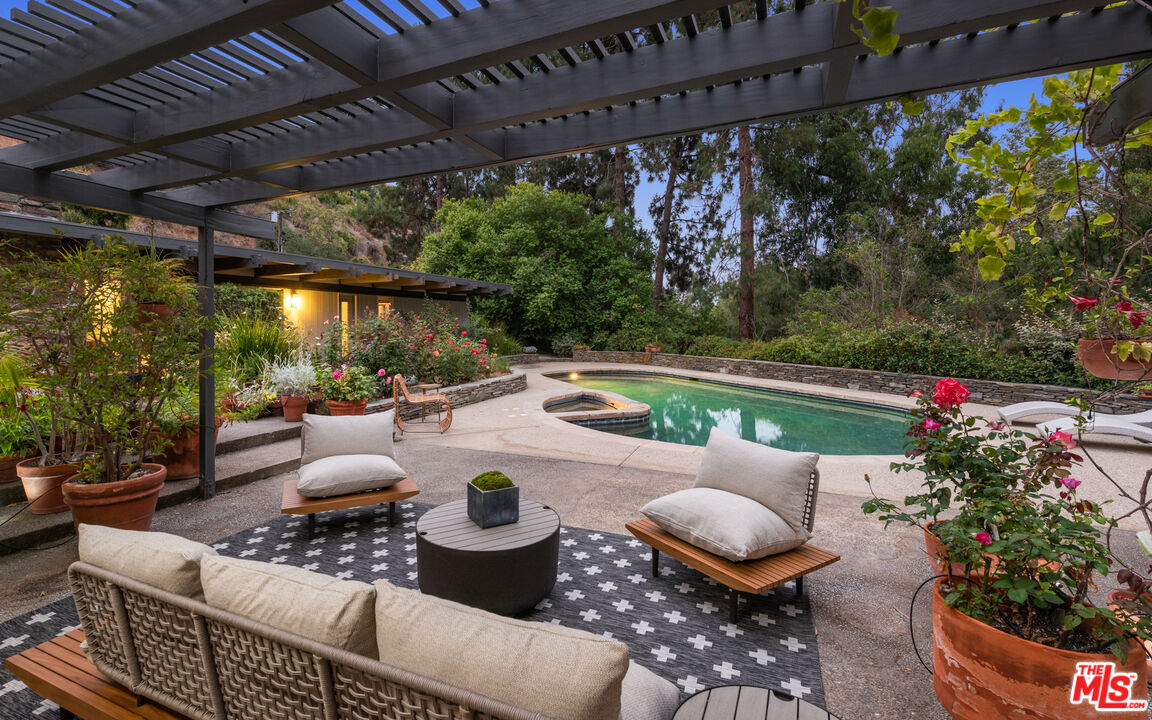 1030 Rivas Canyon Road Pacific Palisades, CA 90272 - Photo 36 of 42 a outdoor living space with furniture and garden view