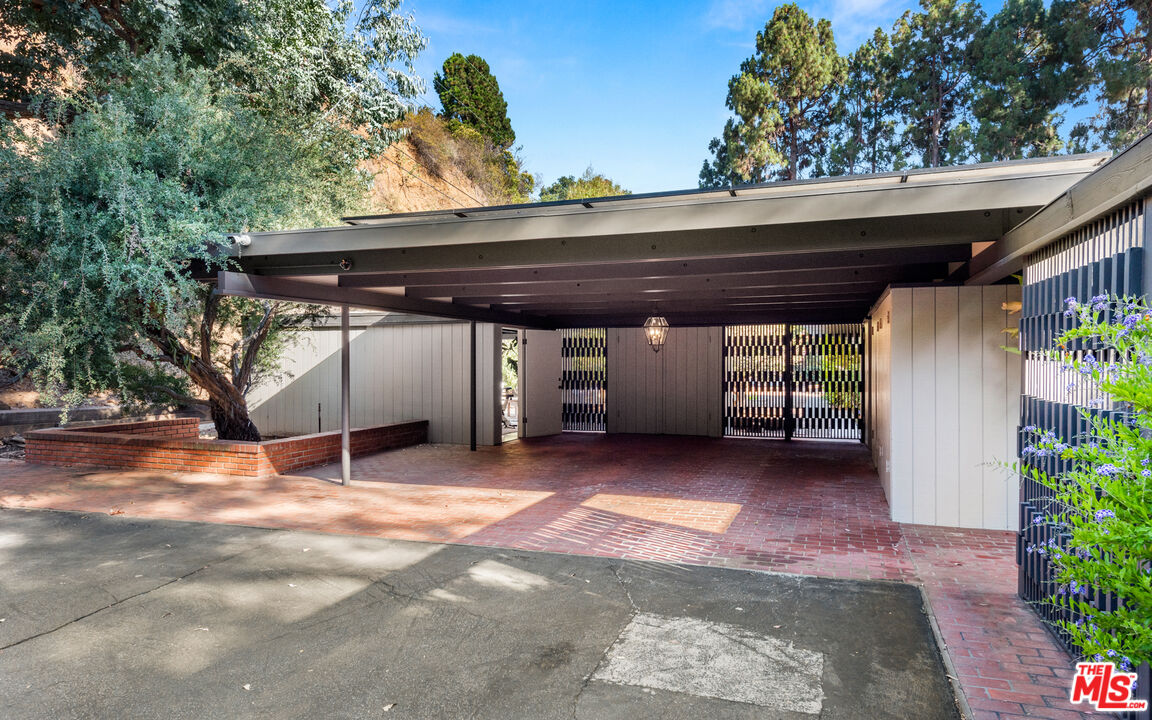 1030 Rivas Canyon Road Pacific Palisades, CA 90272 - Photo 37 of 42 a view of a wooden deck with a backyard